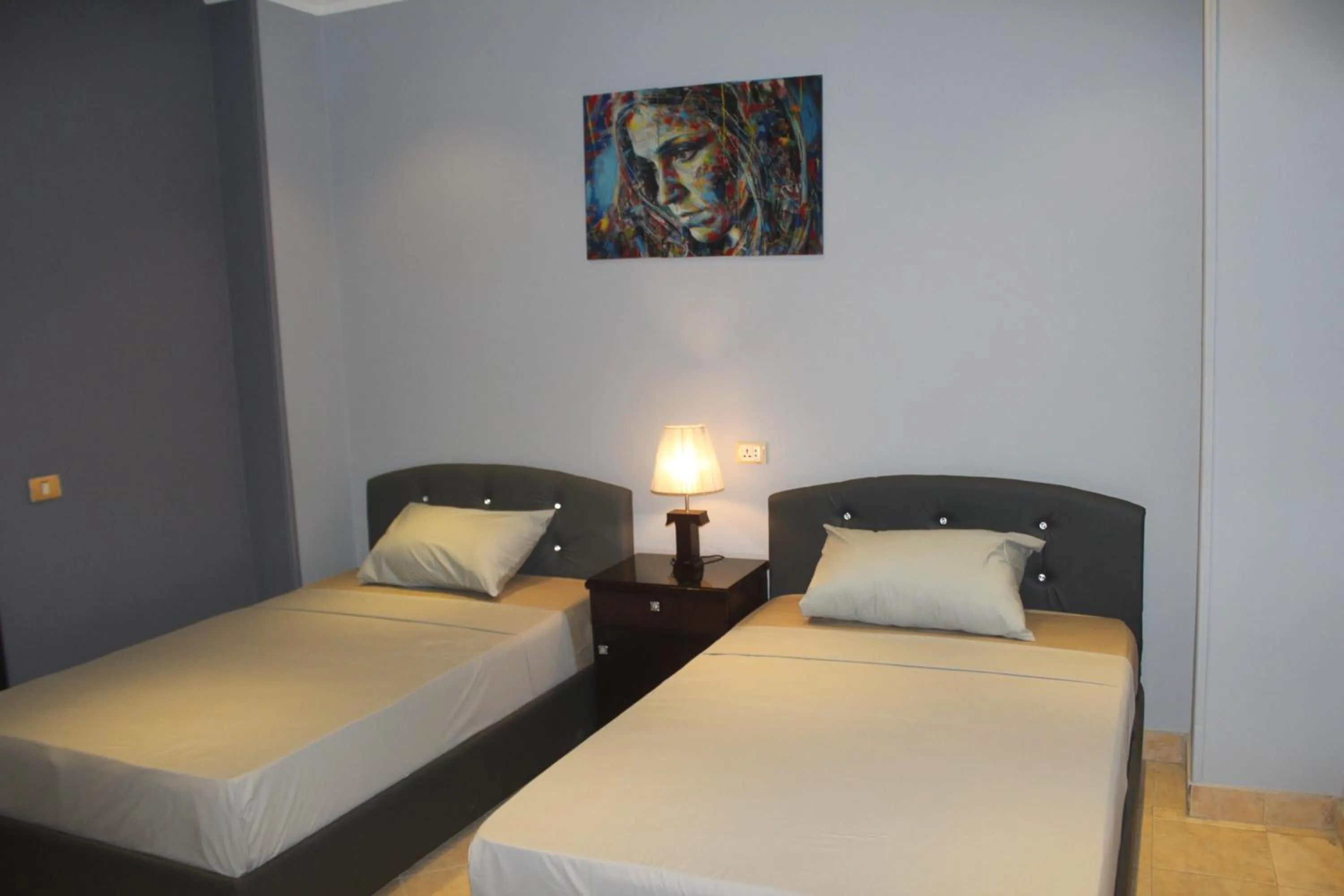 Triple Room with Balcony - single occupancy in Tahrir Square Hostel