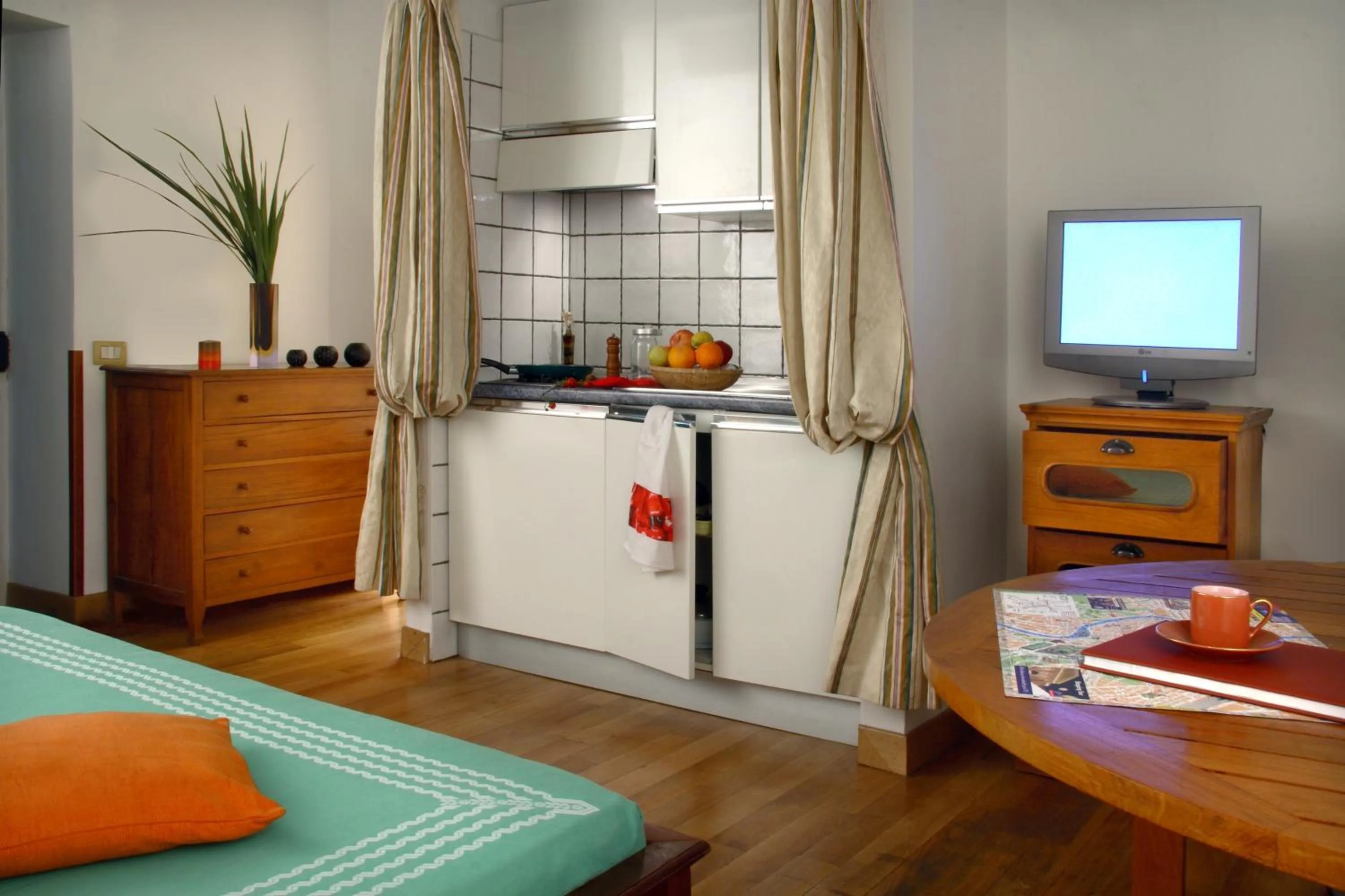 Quadruple Room with Kitchenette in Bollo Apartments