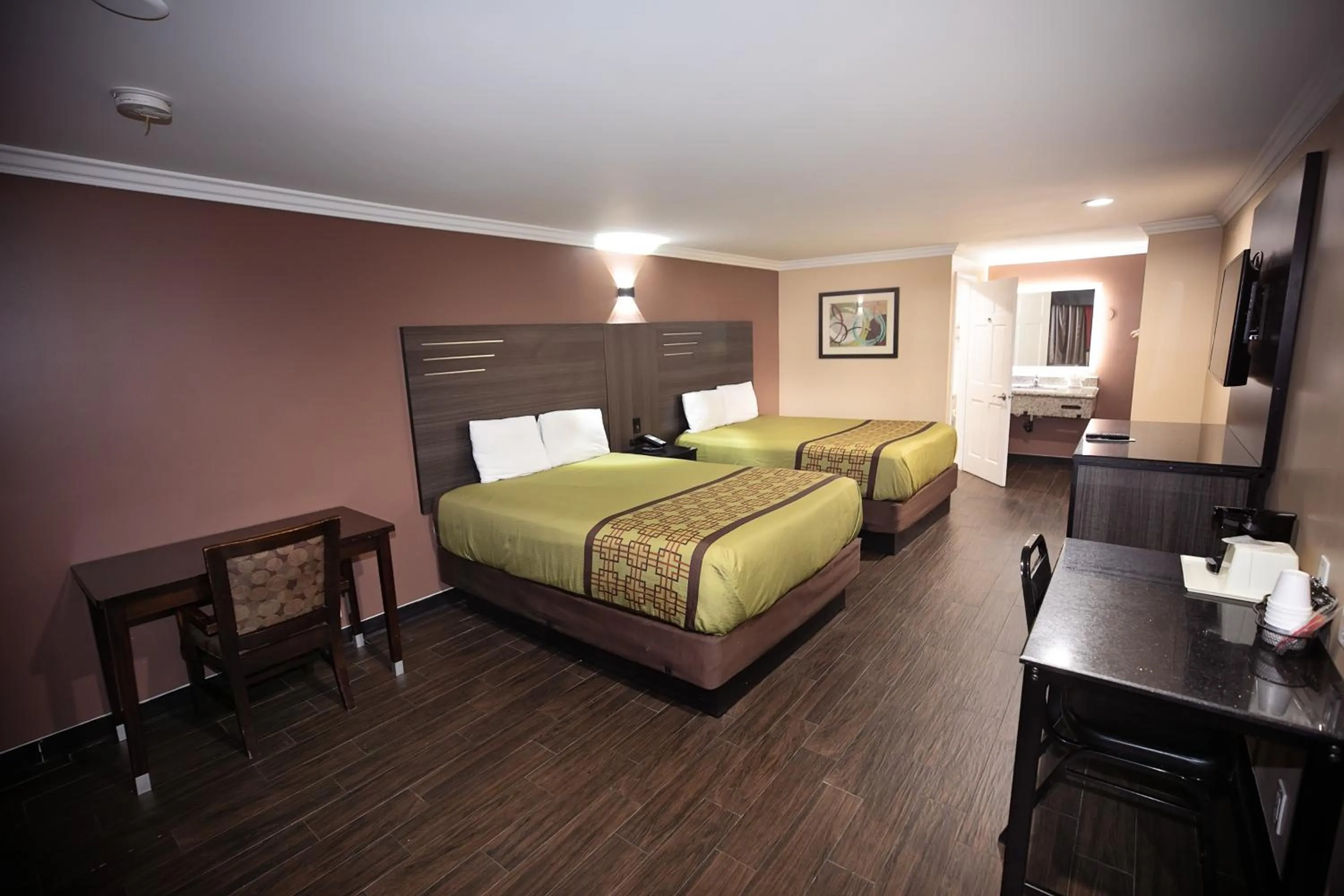 Standard Queen Room with Two Queen Beds - single occupancy - Smoking in Rodeway Inn & Suites