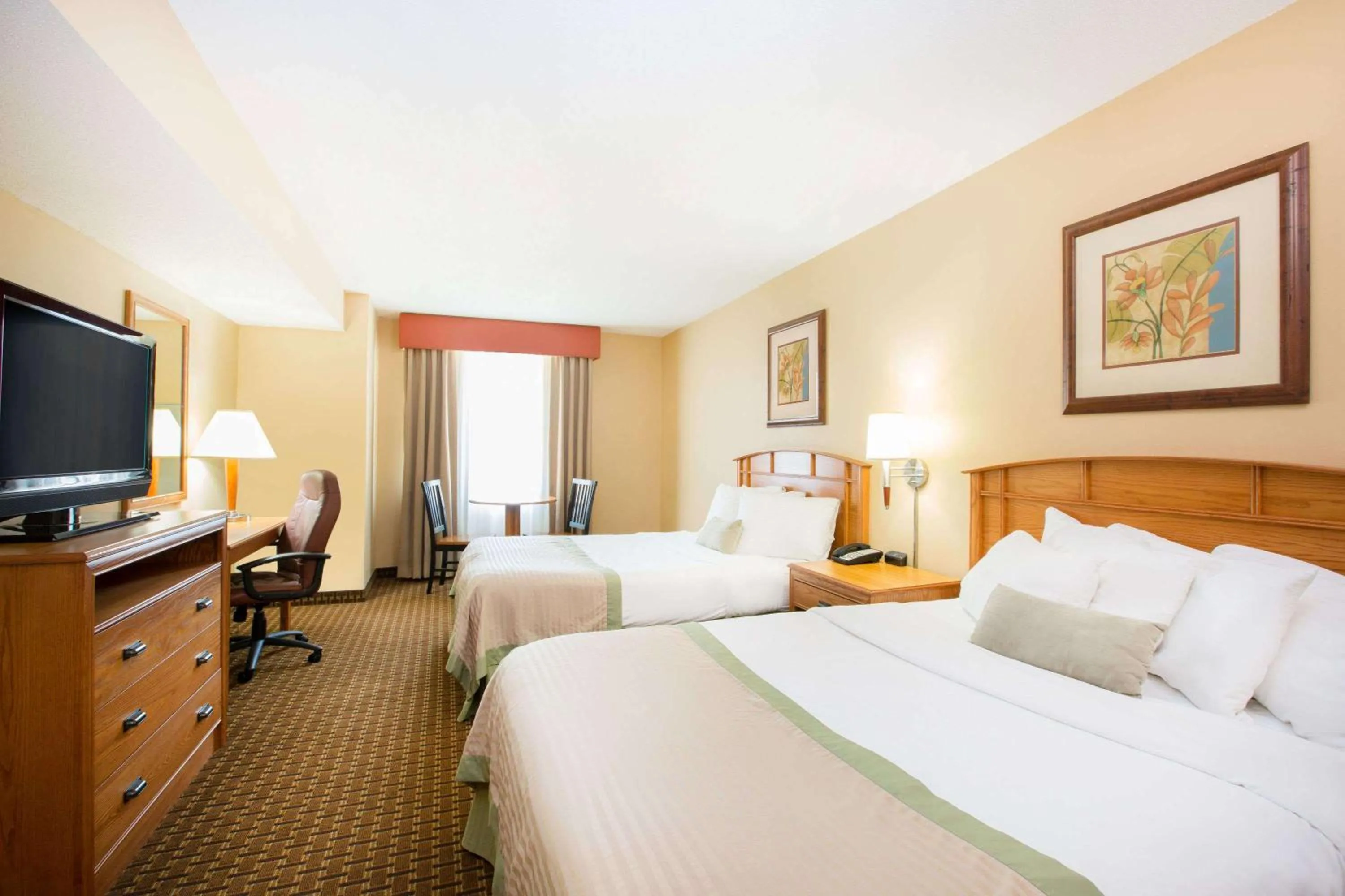 Deluxe Queen Room with Two Queen Beds - Non-Smoking in Ramada by Wyndham Des Moines Tropics Resort & Conference Ctr