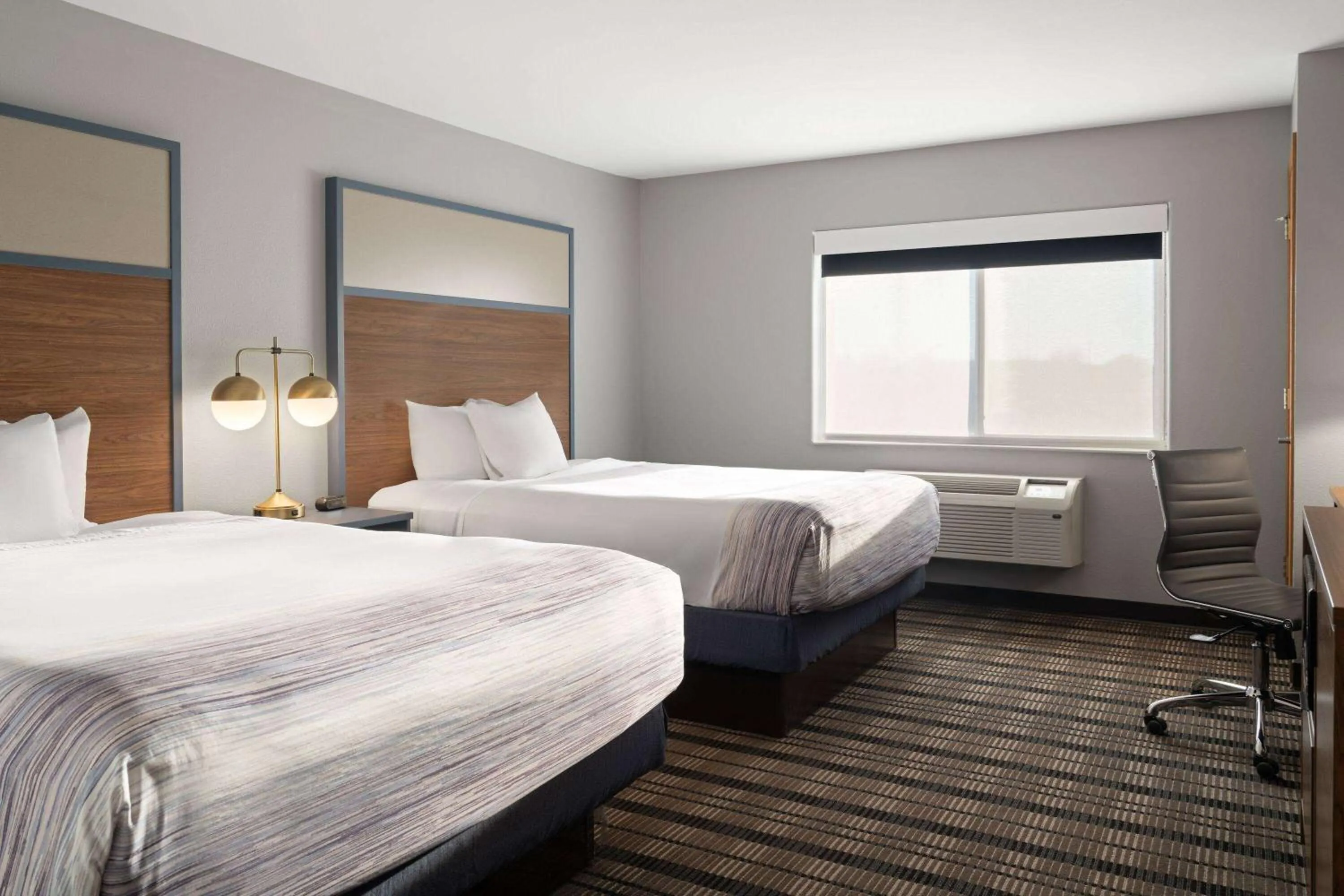 Queen Room with Two Queen Beds - Non-Smoking in AmericInn by Wyndham Beaver Dam