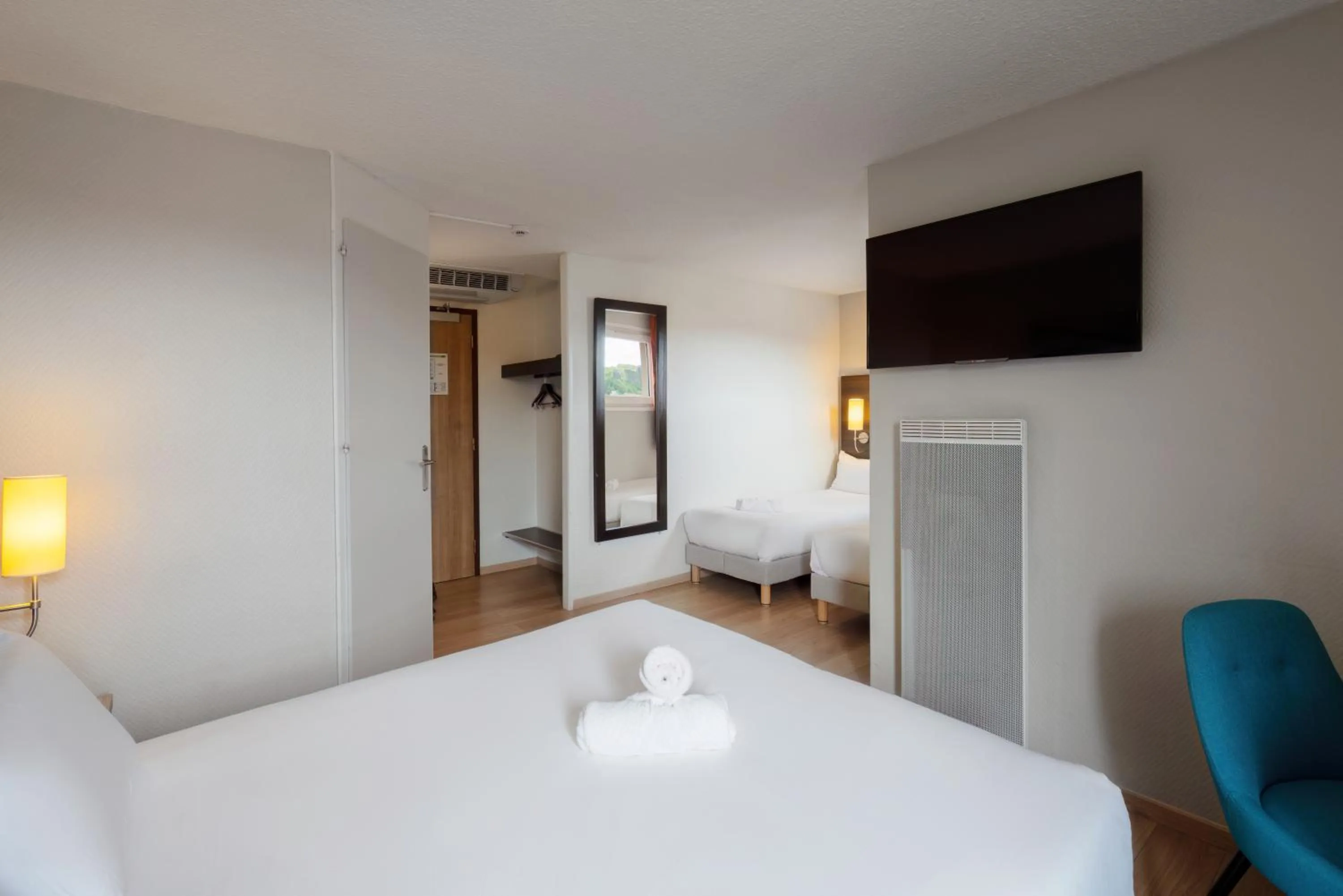 Quadruple Room with One Double Bed and  Two Single Beds in Kyriad Belfort Centre Gare