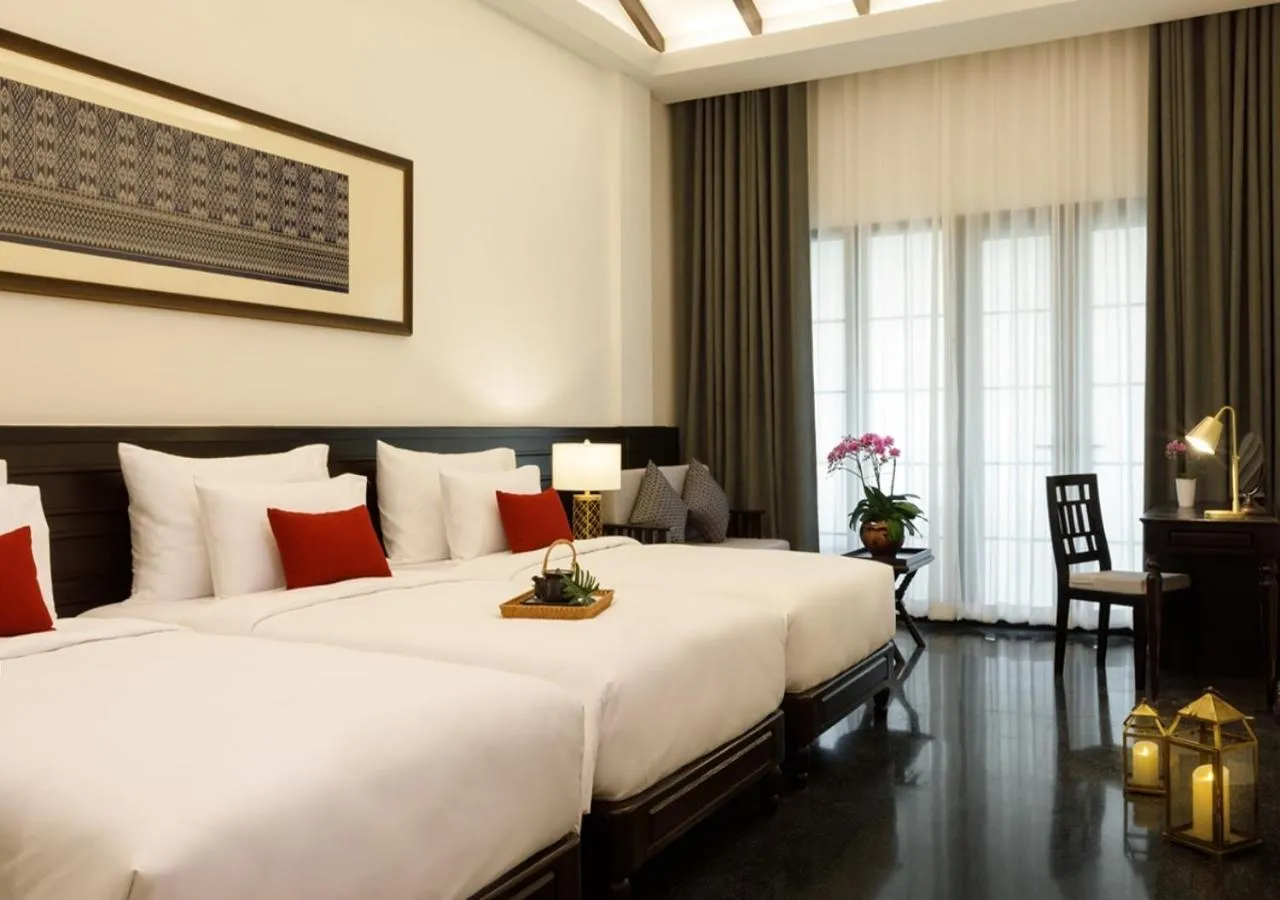 Deluxe Triple Room in Aksara Heritage