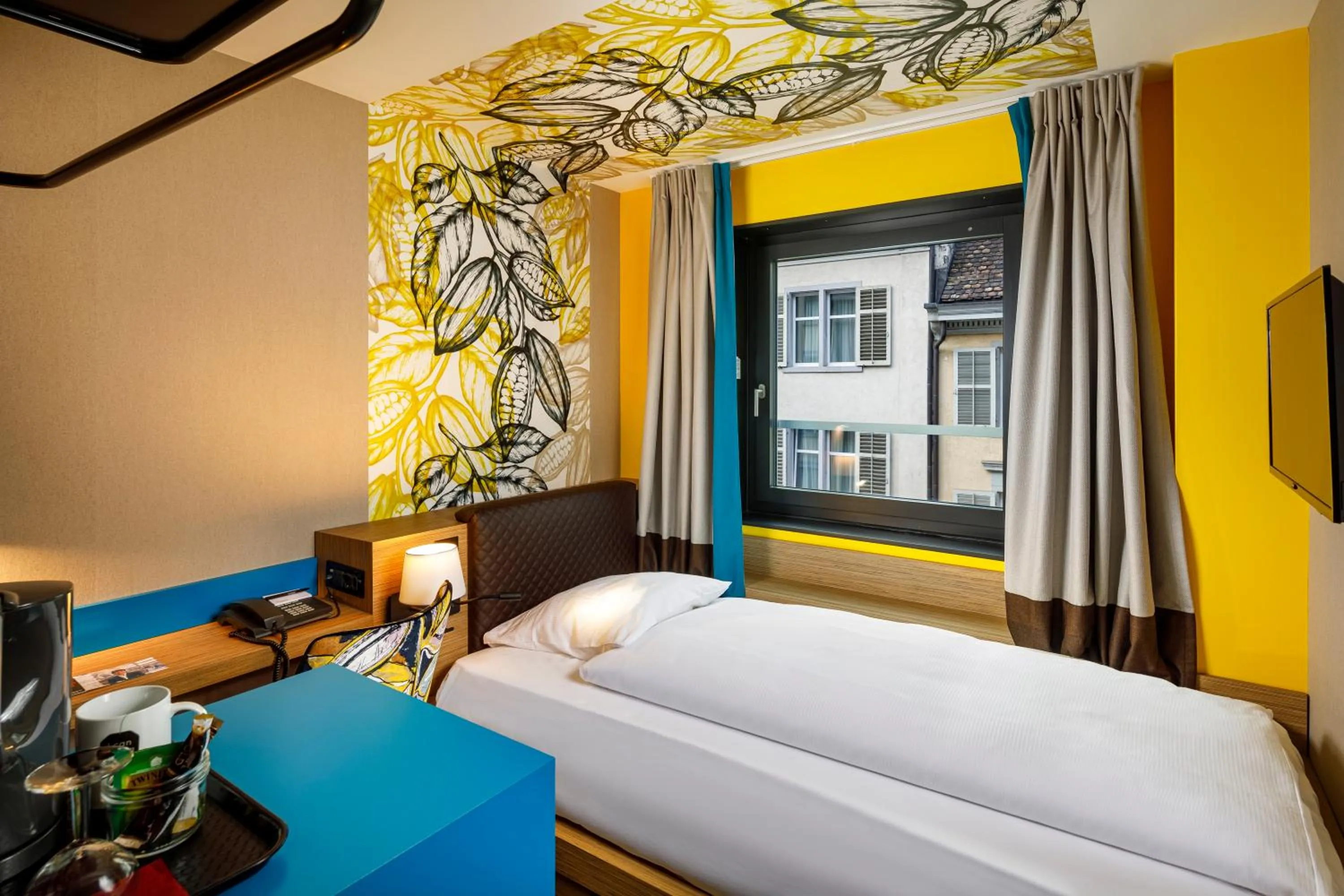 Standard Single Room ( small) in Swiss Chocolate by Fassbind Zurich