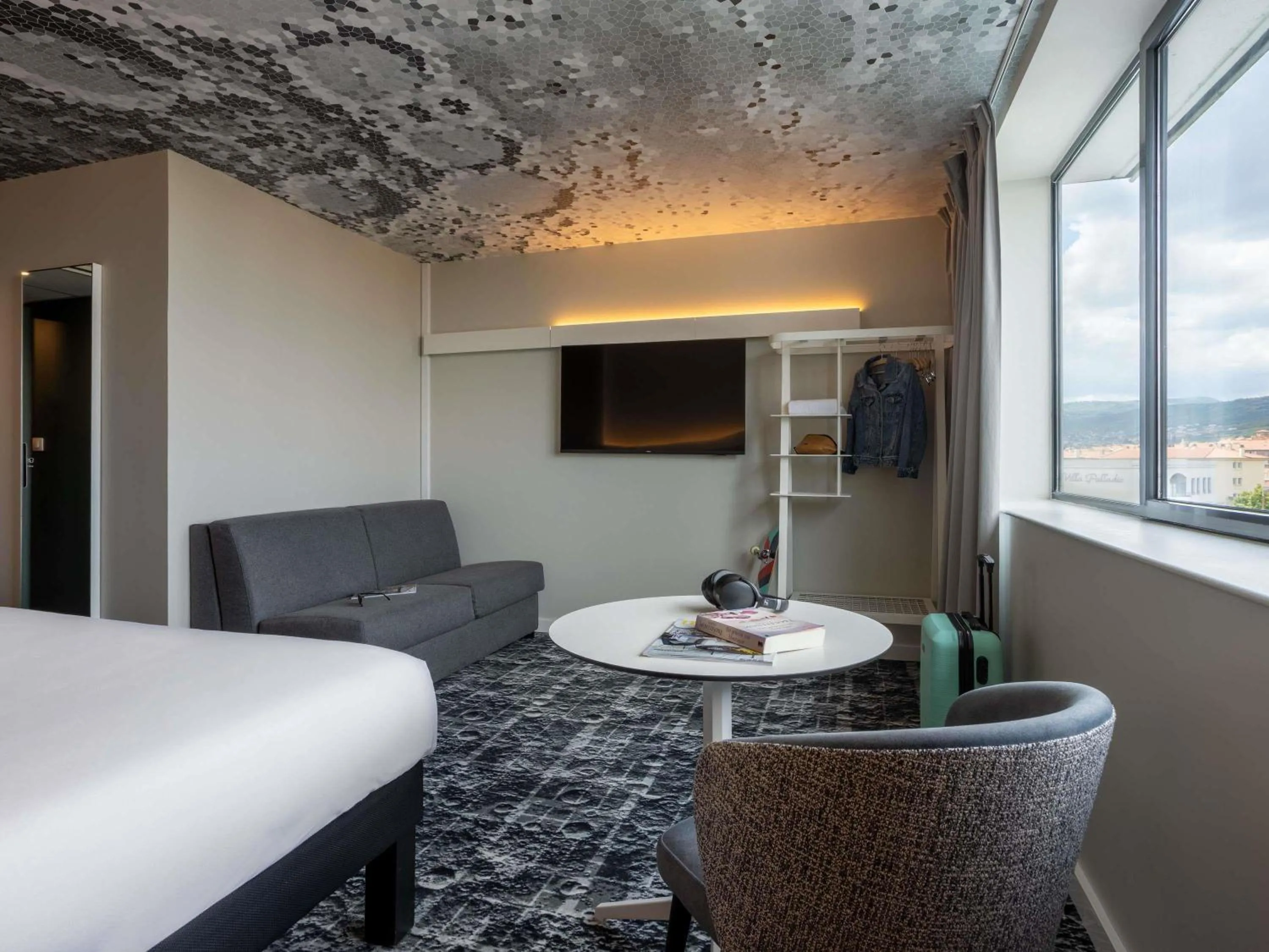 Family room with a double bed and a double sofa bed or two single sofa beds in ibis Clermont Ferrand Montferrand