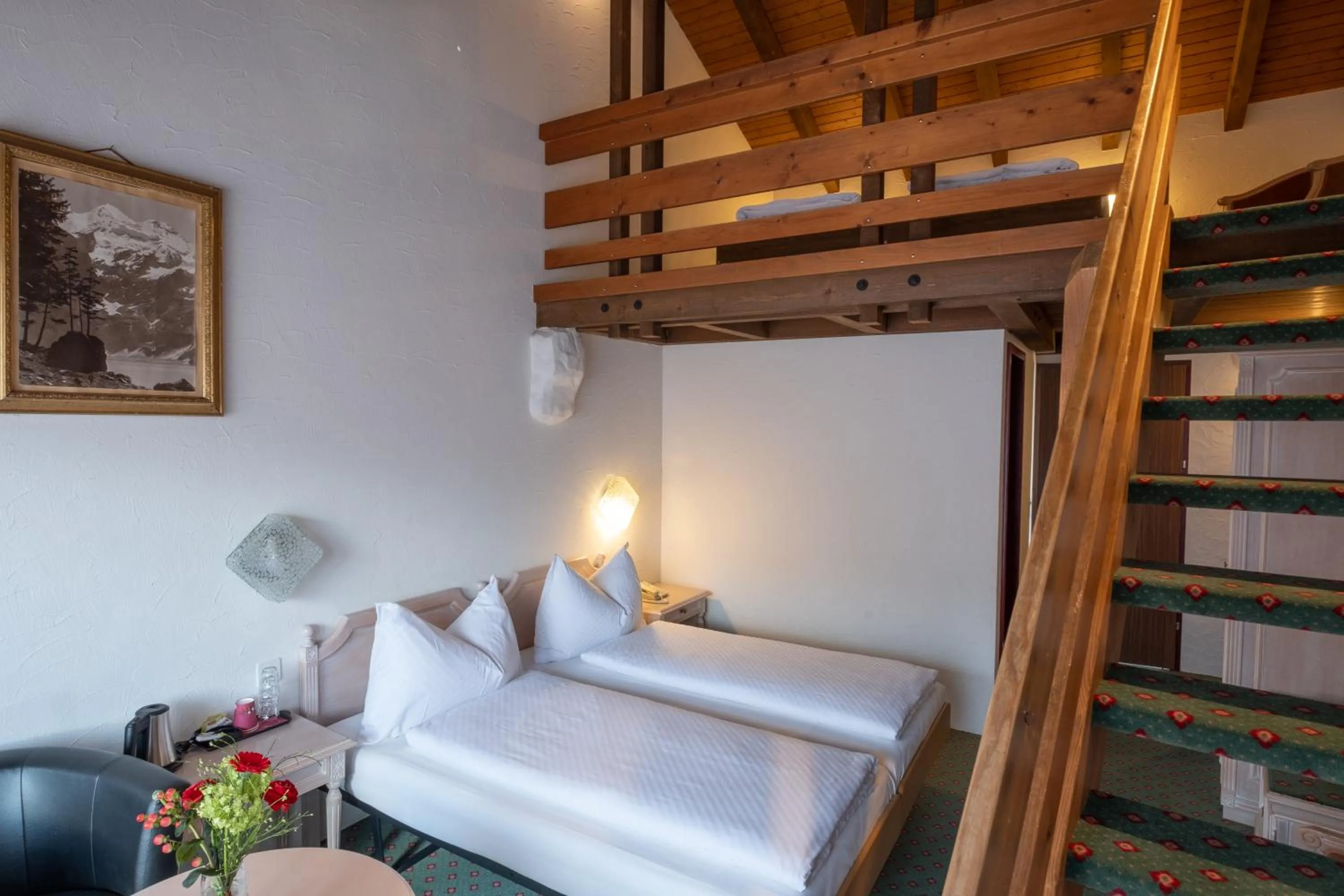 Family Quad Room in Hotel Chalet Swiss