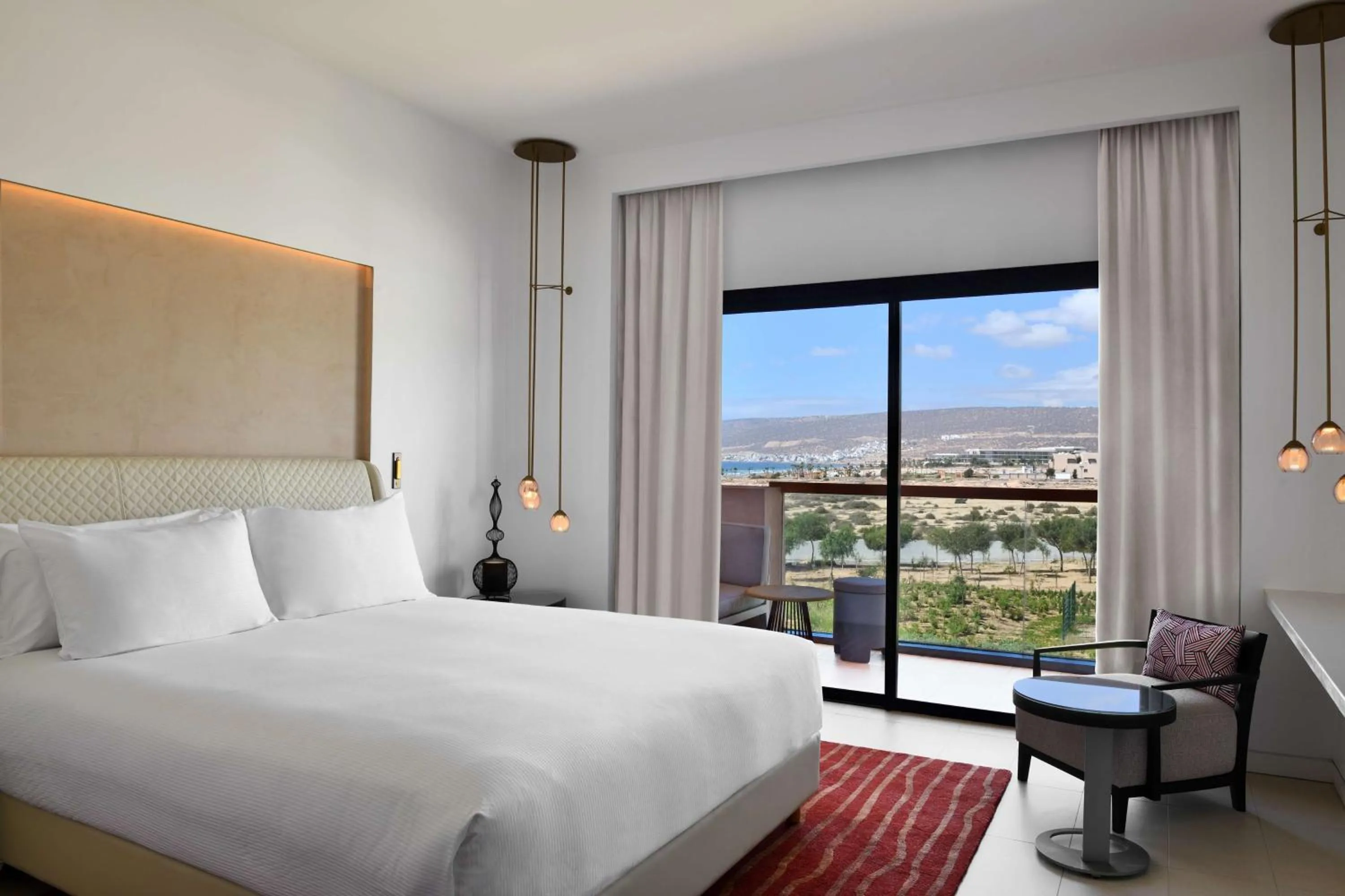 Guest Room with Two Double Beds and Partial Ocean View in Hilton Taghazout Bay Beach Resort & Spa