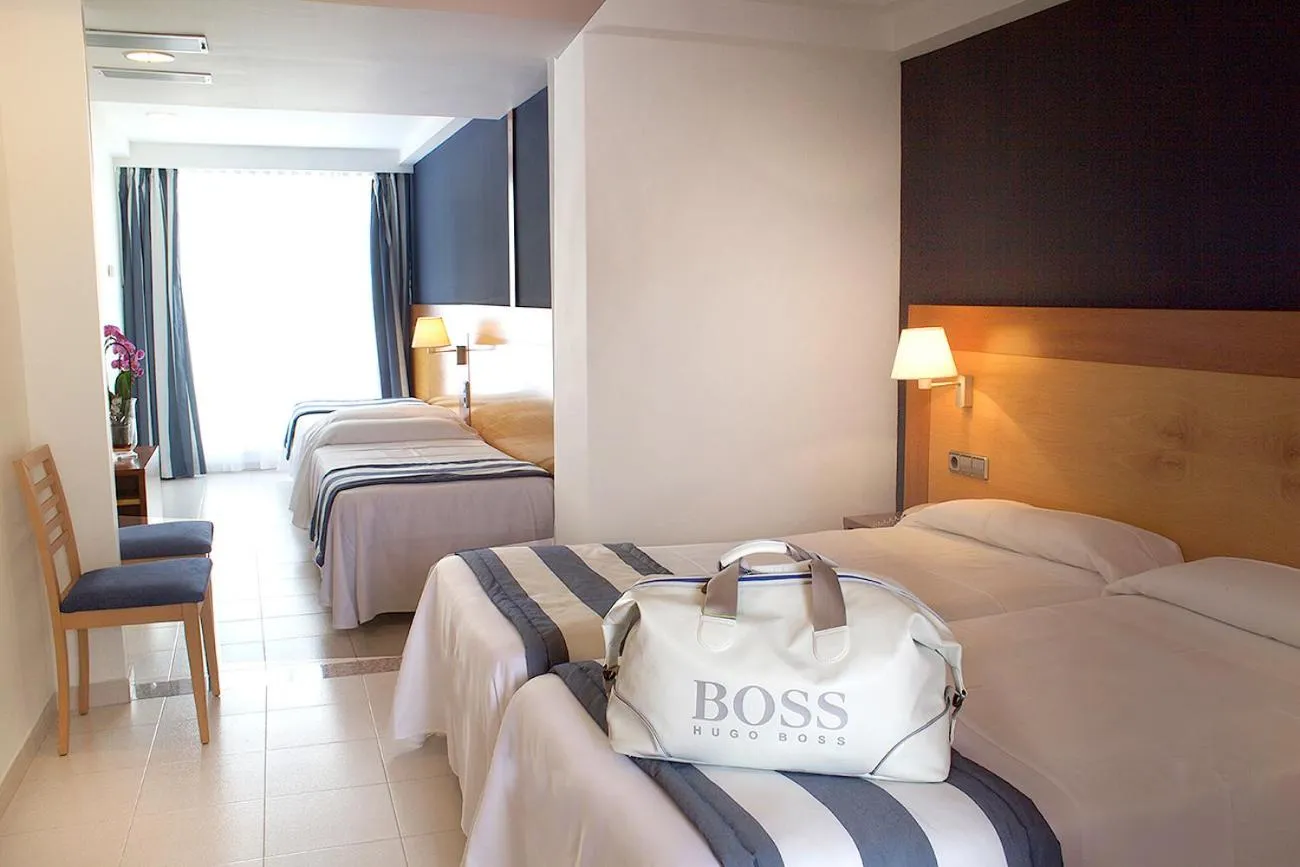 Quadruple Room with Balcony  (2 Adults + 2 Children) in Hotel Els Pins